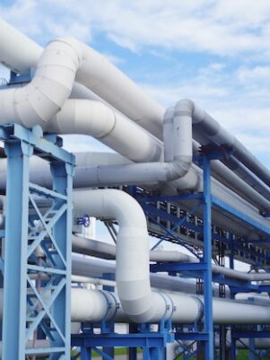 closeup-industrial-pipelines-around-factor-sunny-day_181624-58546